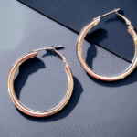 Golden twisted hoop earrings modern design