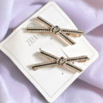 Stone-studded cross hair clips for girls