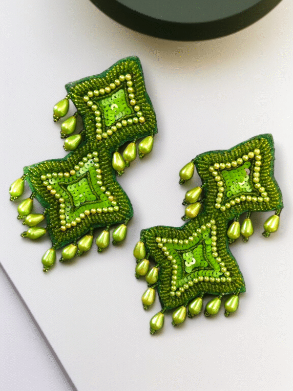 Statement handmade earrings with stone and pearl embroidery.